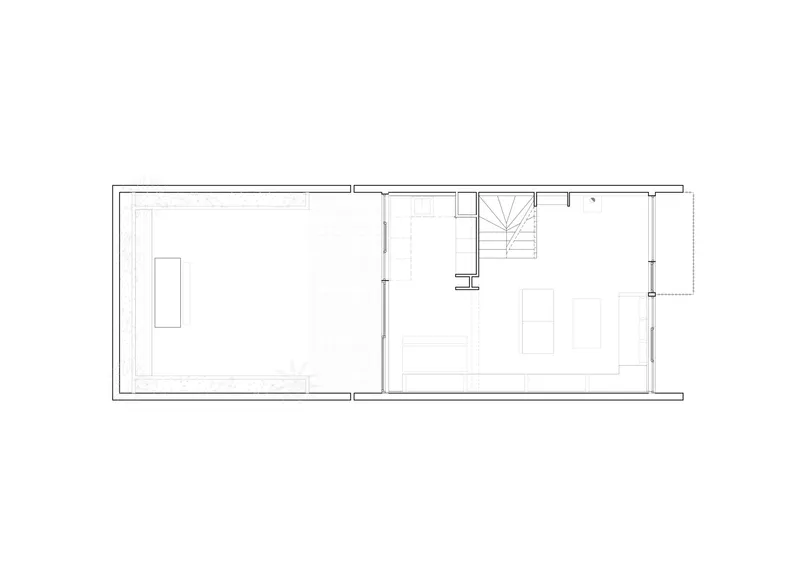 Floor plan drawing showing two rectangular rooms divided by a wall with central stair
