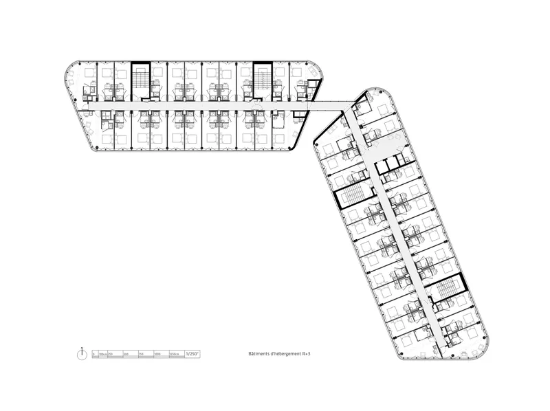 Floor plan drawing illustrating two angled wings with repeating units and central stair towers
