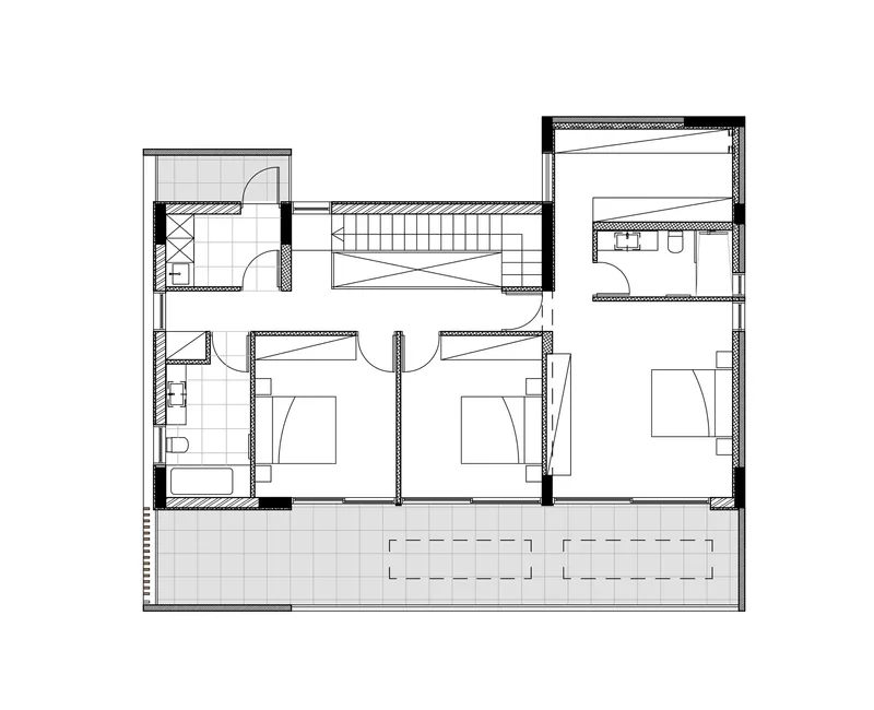 Floor plan drawing depicting the upper level with bedrooms and a central staircase