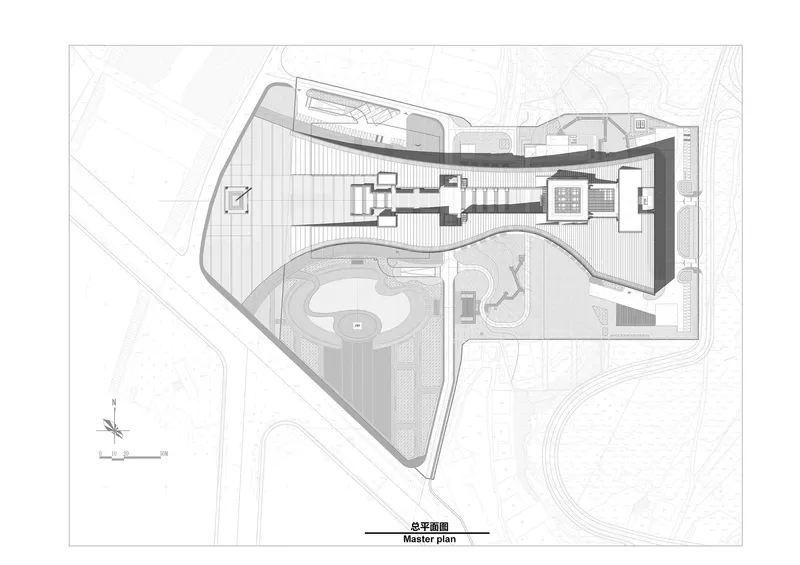 Site plan drawing showing the angular building footprint with surrounding landscape and water features