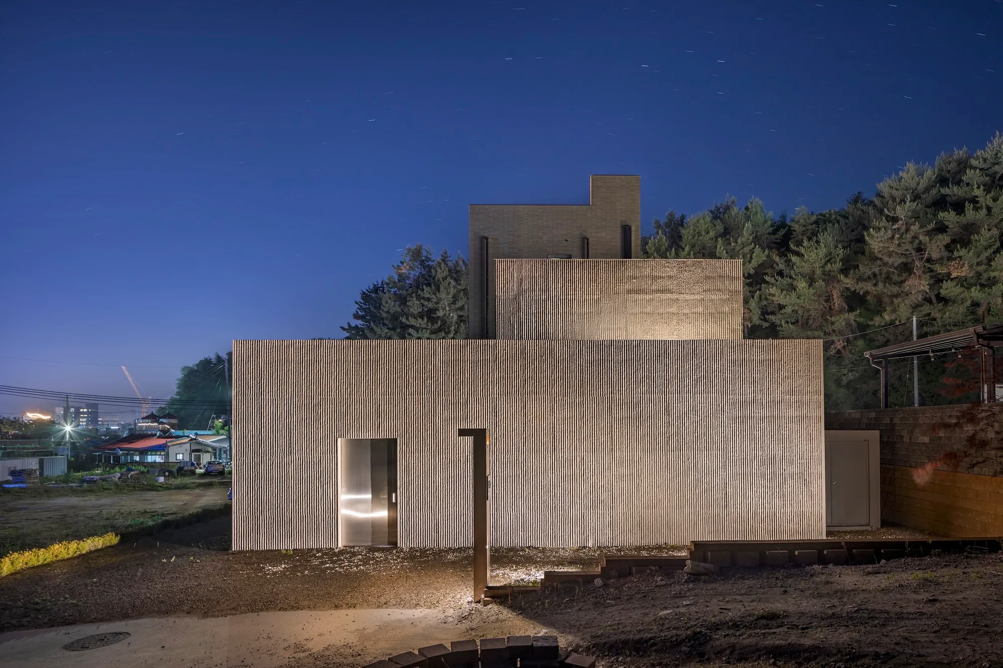 DRAWING WORKS Carves a Concrete Surf Retreat into a Korean Hillside Near the East Sea