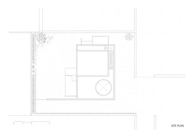 Site plan drawing showing rectangular volumes with circular element and perimeter planting