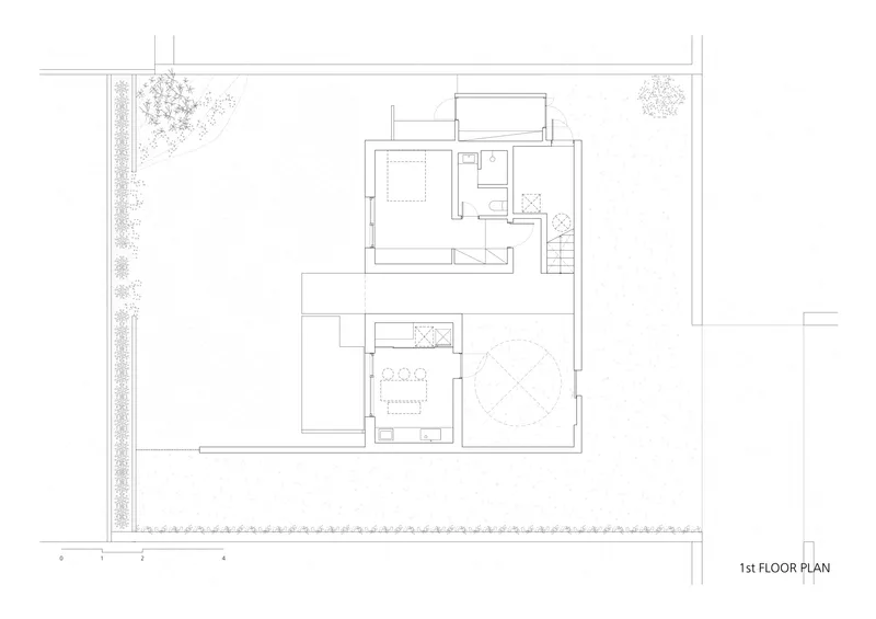 First floor plan drawing showing staircase connecting split-level spaces with circular element below