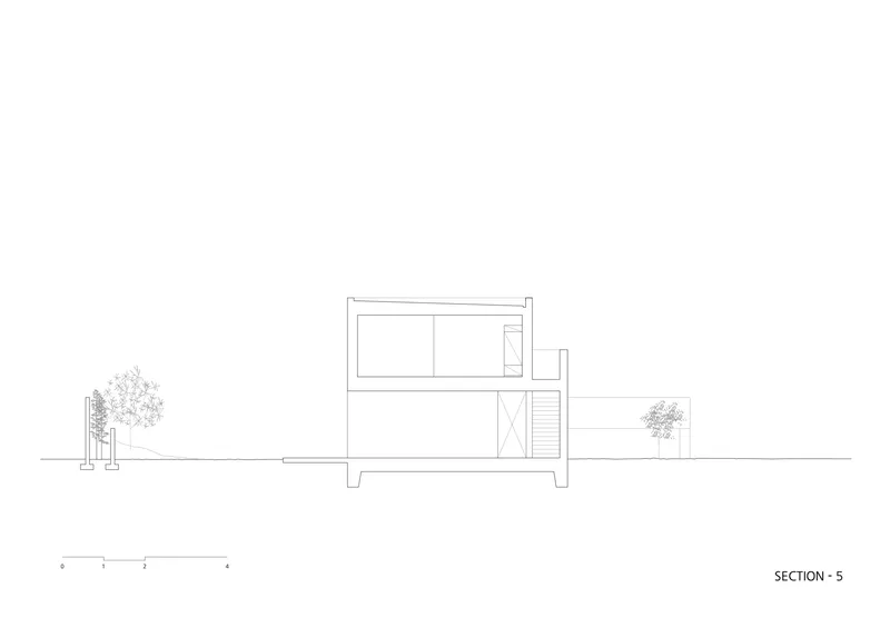 Section drawing illustrating a compact two-story volume elevated on pilotis with adjacent vegetation