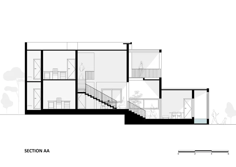 Section drawing showing split-level interior spaces connected by two staircases with human figures