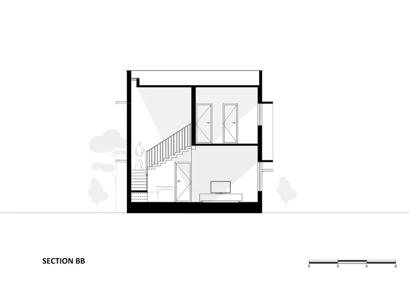Section drawing showing the two-story staircase and living space with perforated screen elements