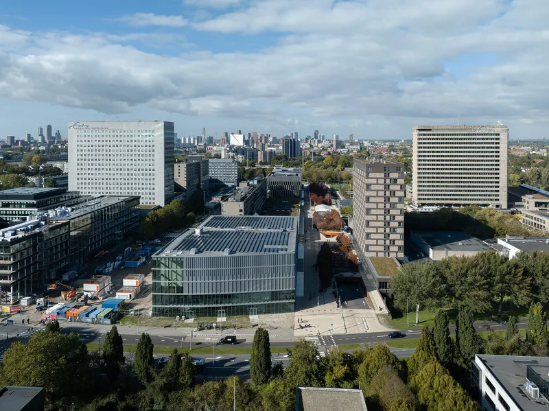 Aerial view of the metal-clad roof with photovoltaic panels under a cloudy sky