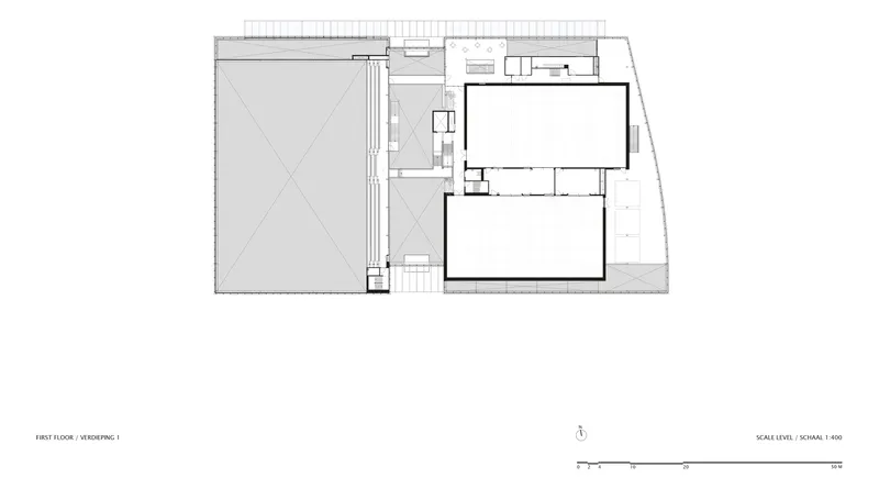 First floor plan drawing showing a large sports hall and smaller rectangular volume
