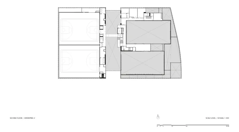 Second floor plan drawing showing two sports courts and a central circulation spine