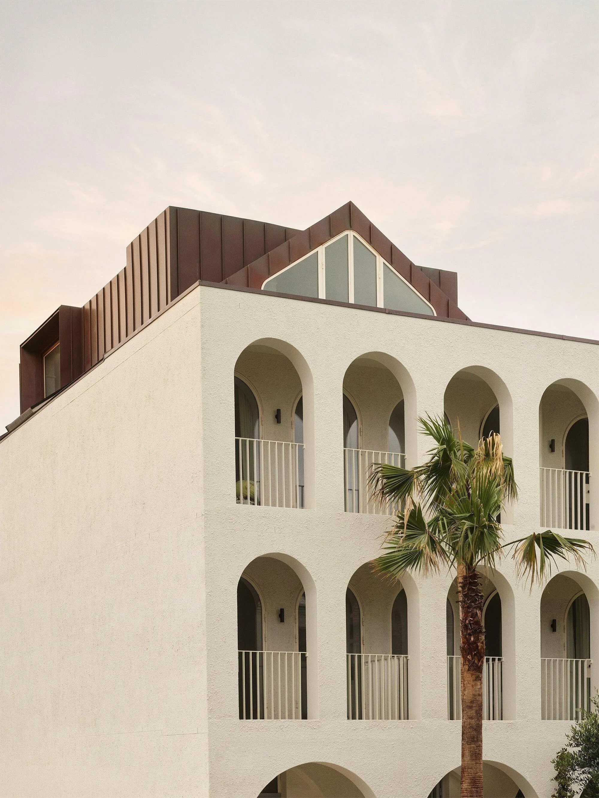 Common Office Wraps a Four-Storey Bondi Beach Villa in Arches, Brick, and Copper