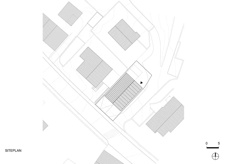 Site plan drawing showing building footprints and street layout at an angled orientation
