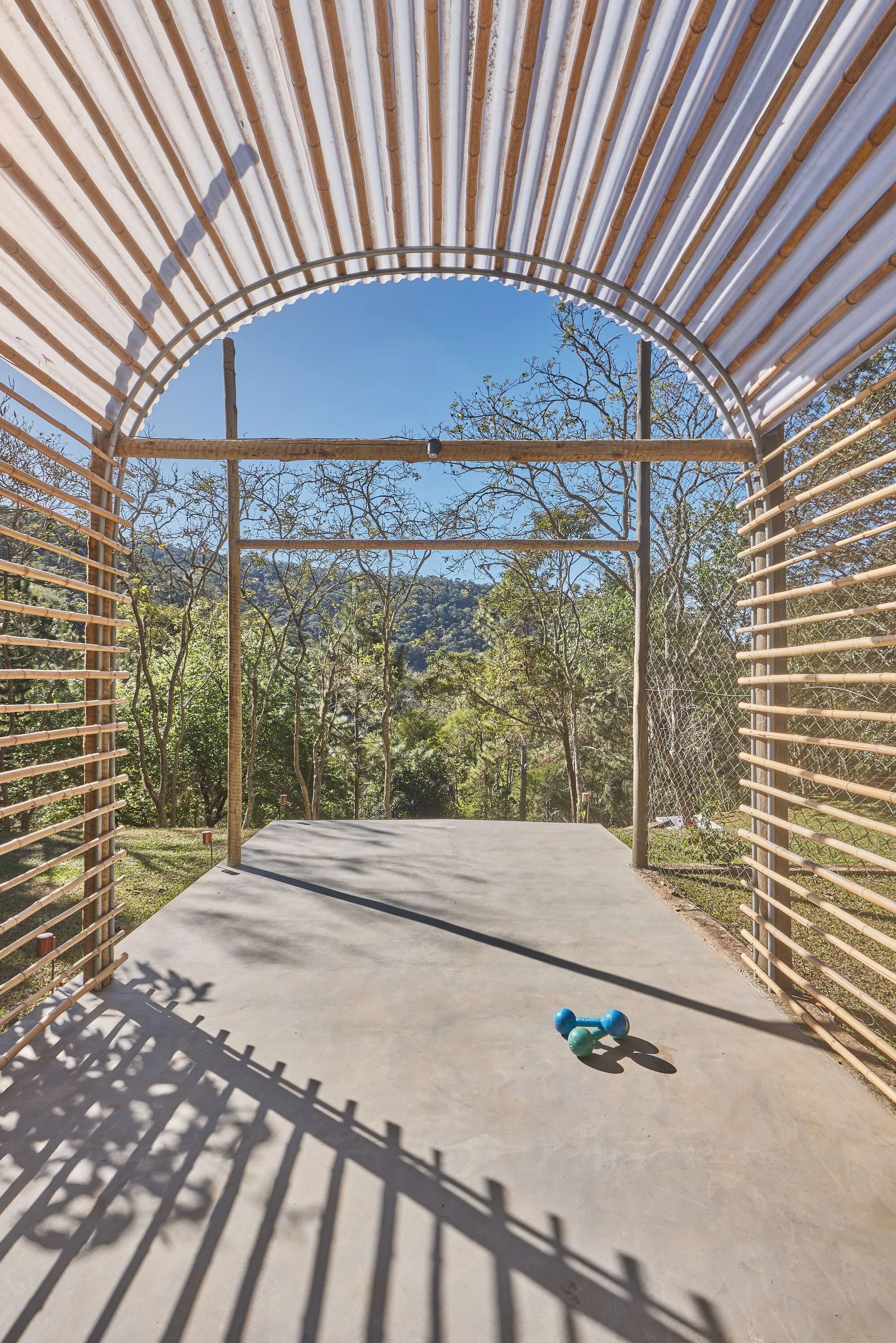 gru.a Wraps a 20-Square-Meter Fitness Shelter in Bamboo and Polycarbonate at Petrópolis