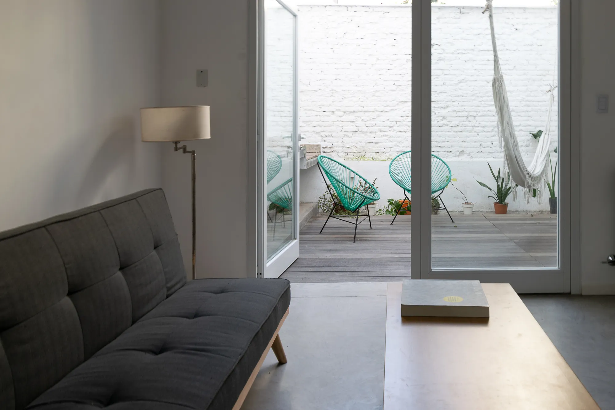 Sitio Arquitectura Carves a Courtyard and Staircase into a Tucumán Row House