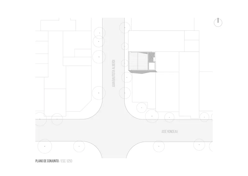 Site plan drawing showing a small structure positioned on a corner lot with street trees