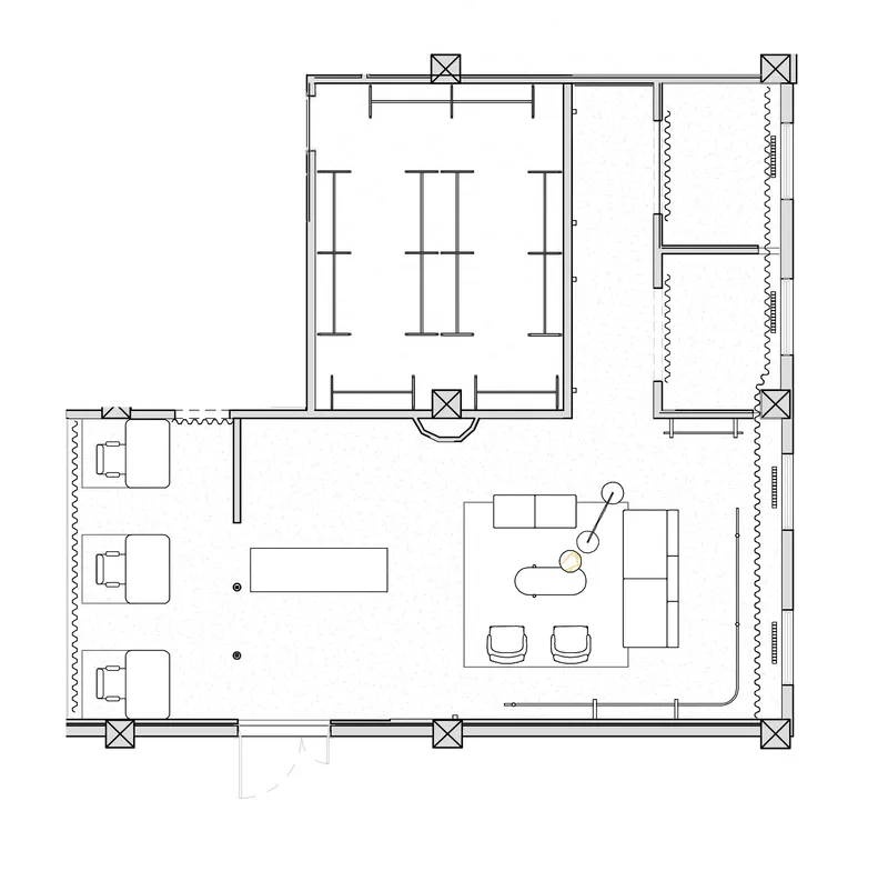 Floor plan drawing showing main retail space with display tables and enclosed fitting rooms