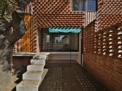 Francisco Cadau Weaves a Brick Curtain Across Four Row Houses in Campana, Argentina