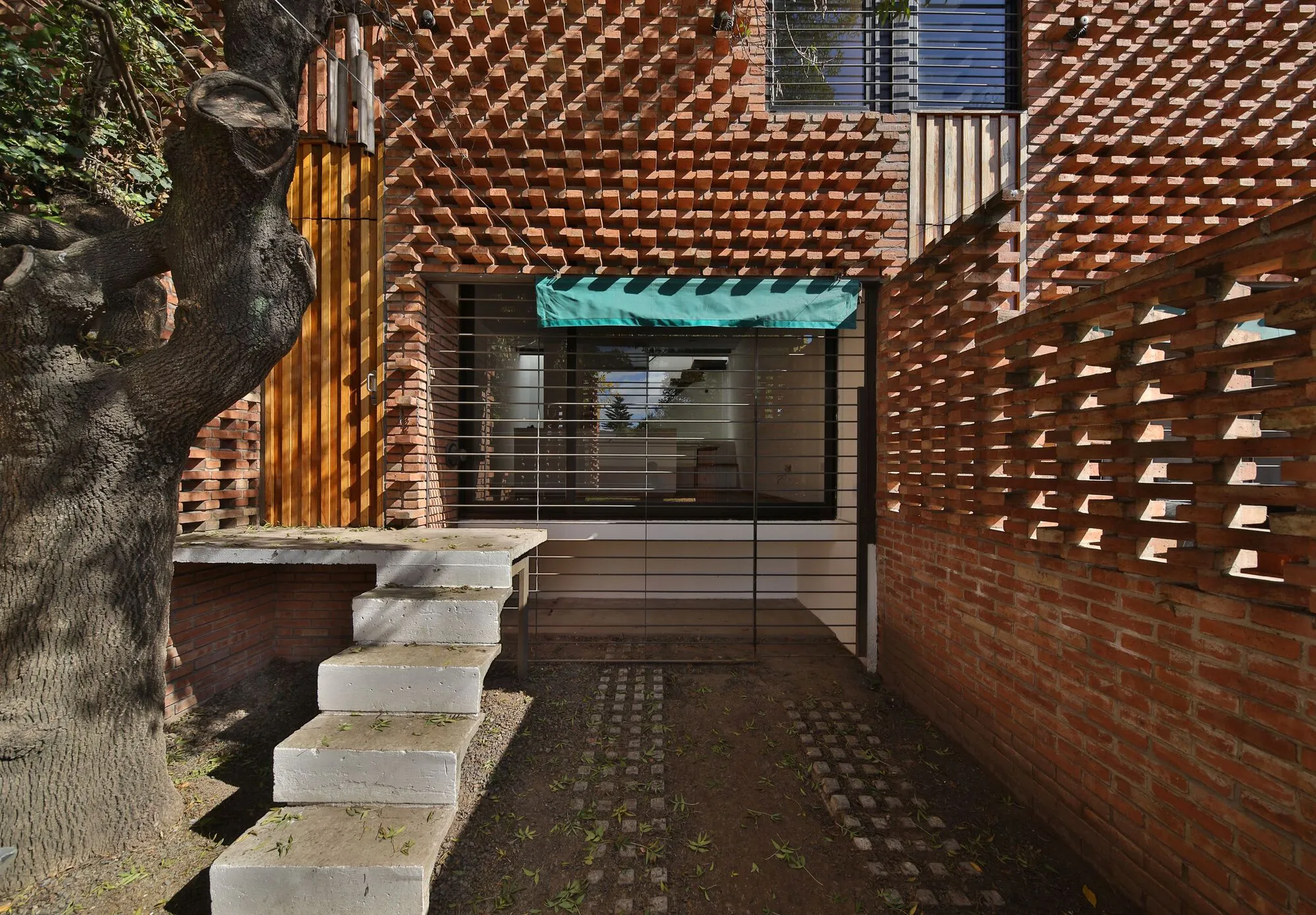 Francisco Cadau Weaves a Brick Curtain Across Four Row Houses in Campana, Argentina