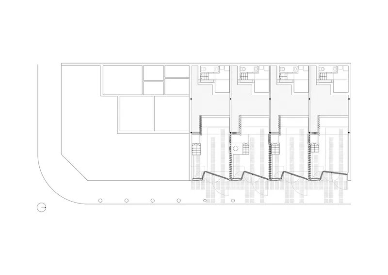 Floor plan drawing showing four rowhouse units with staircases and terraces along a curved street