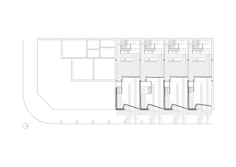 Upper floor plan drawing showing four units with private terraces indicated by hatched paving