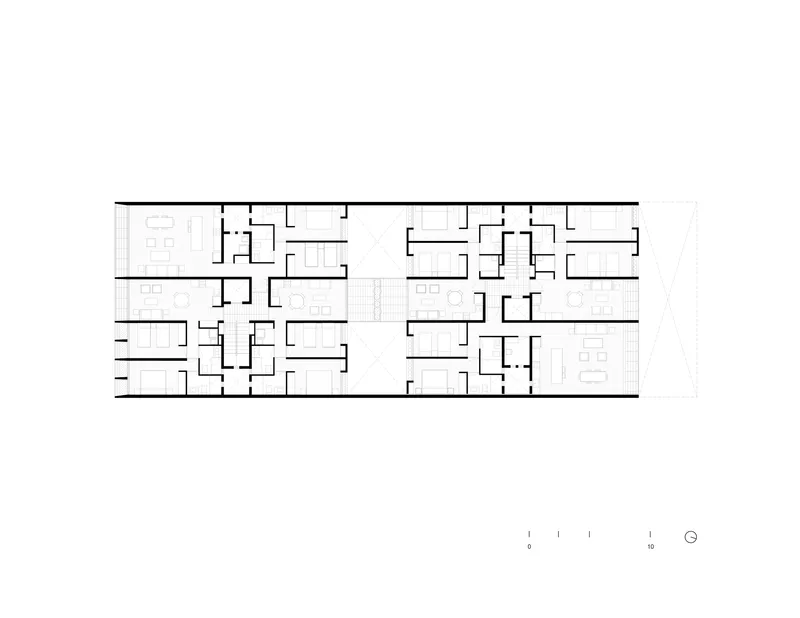 Floor plan drawing showing residential units arranged around vertical circulation with varied apartment layouts