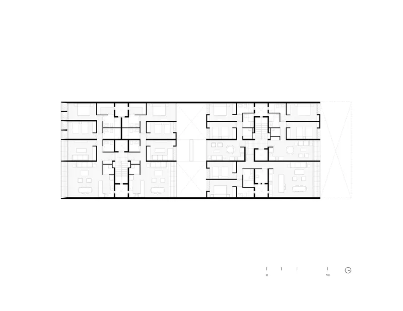 Floor plan drawing showing residential units with symmetrical layouts and central corridor access