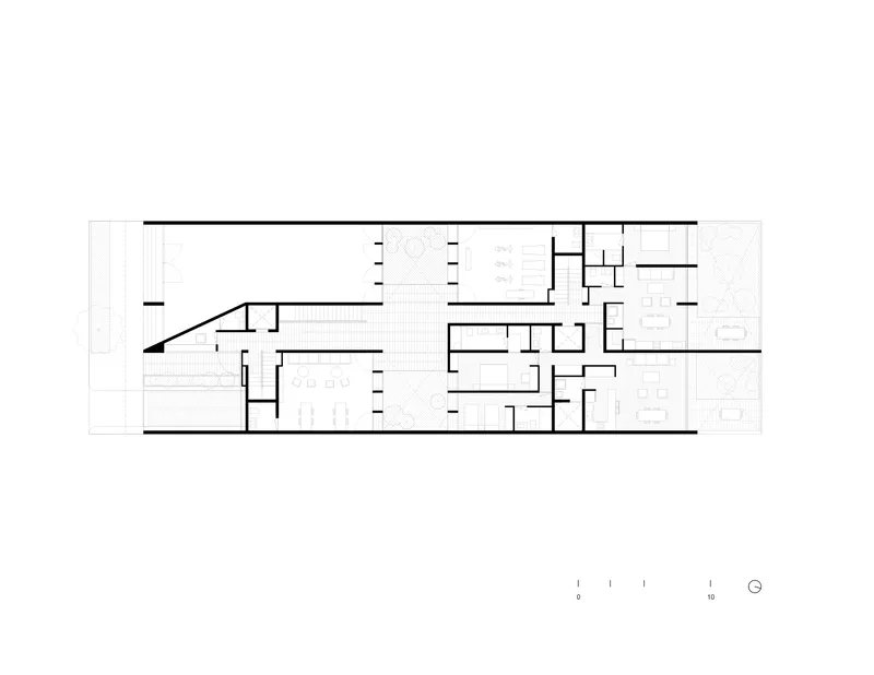 Floor plan drawing showing a linear arrangement of rooms with interior courtyards and terraces