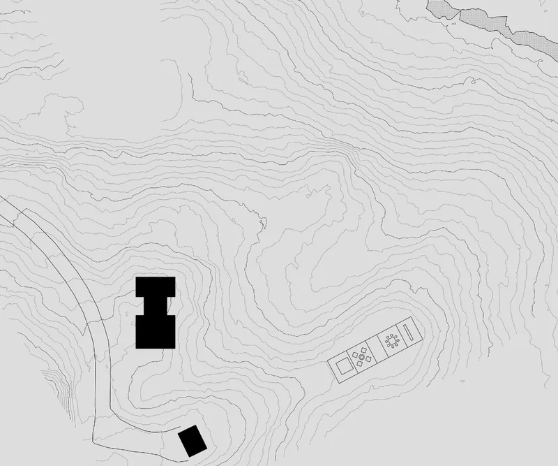 Site plan drawing showing building footprints and topographic contour lines on a sloped wooded terrain