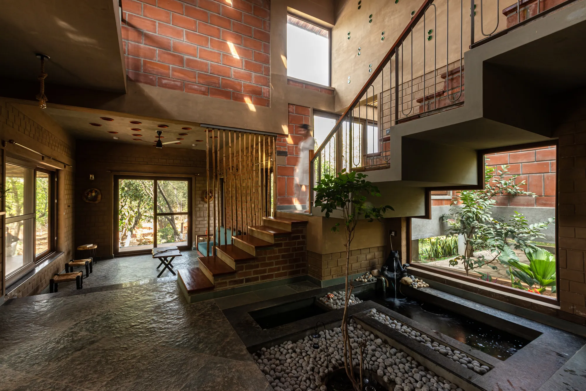 HabitArt Architecture Studio Folds a Brick Farmhouse into a Mango Grove in Southern India