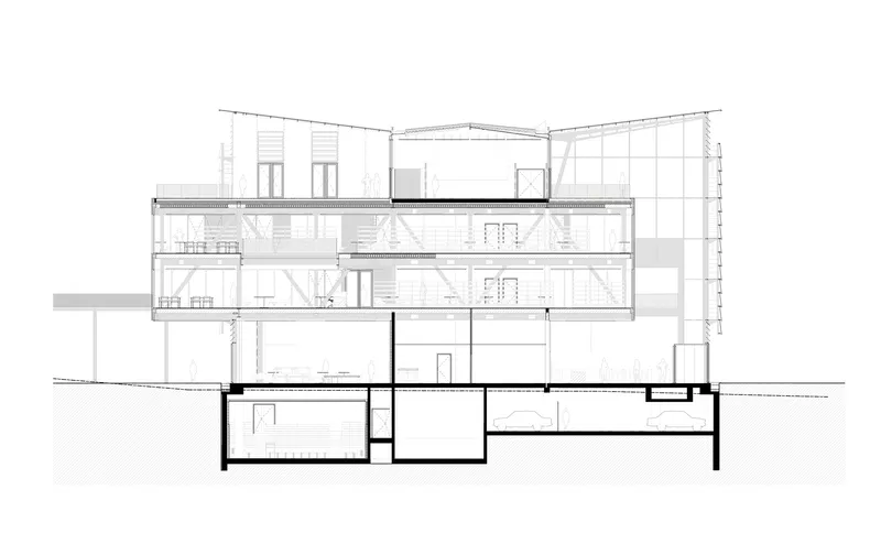 Section drawing showing multi-level interior spaces with stairs, thick walls and basement rooms below grade
