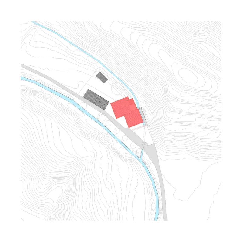 Site plan drawing showing building footprints along a curved waterway with topographic contours