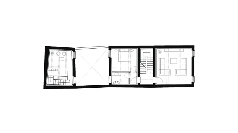 Floor plan drawing showing a narrow multi-room layout with staircase and angled wall at left