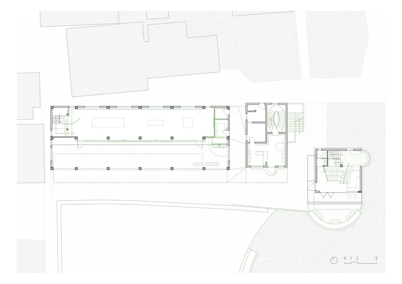 Ground floor plan drawing showing the long exhibition hall with structural columns and adjacent service rooms