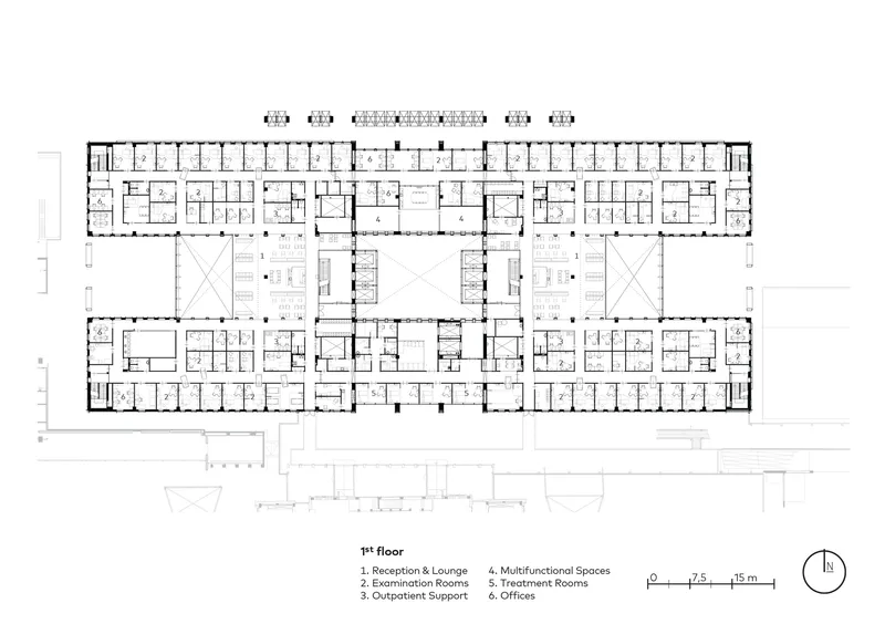 Floor plan drawing showing symmetrical wings with patient rooms flanking central circulation and service cores
