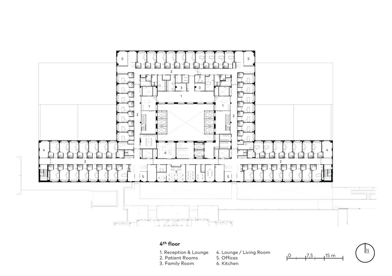 Fourth floor plan showing repeating patient room units along corridors with central circulation zone