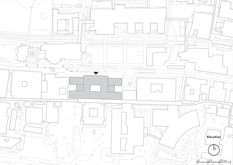 Site plan drawing situating three linked volumes within the surrounding urban fabric