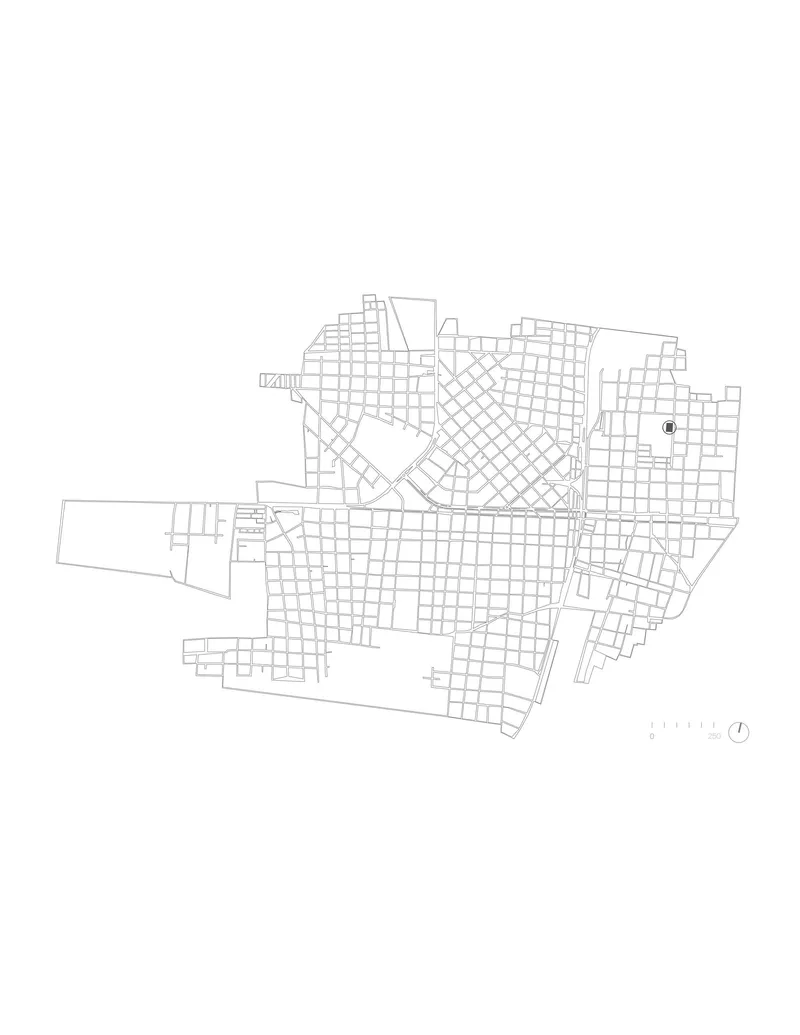 Site plan drawing showing building footprint within surrounding urban grid and street network