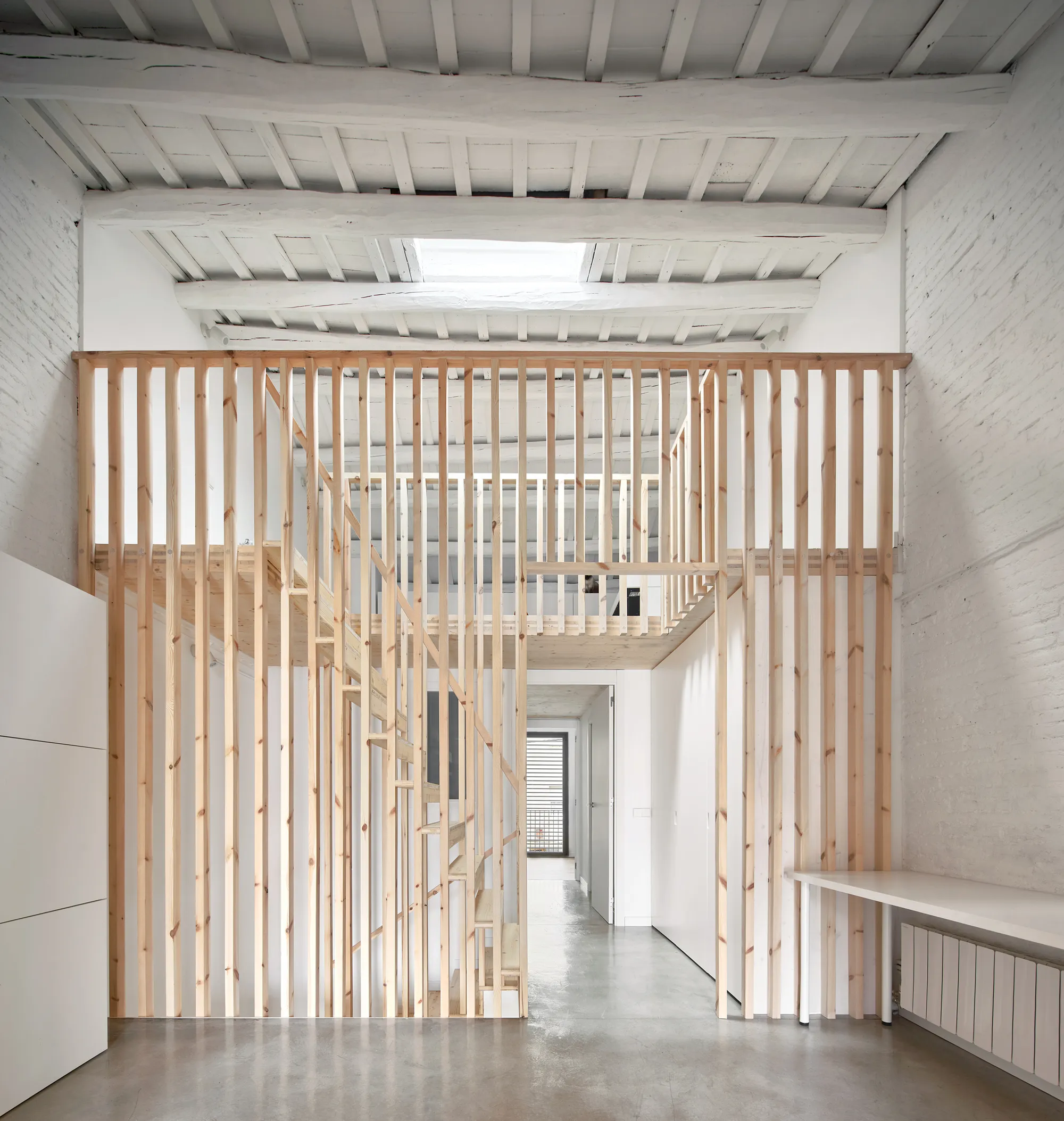Vallribera Arquitectes Threads CLT and White Paint Through a Century-Old Terrassa Row House