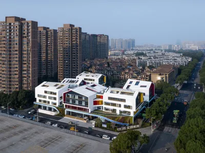LYCS Architecture Breaks a Shaoxing Pre-School into Six White Cabins Around a Green Carpet