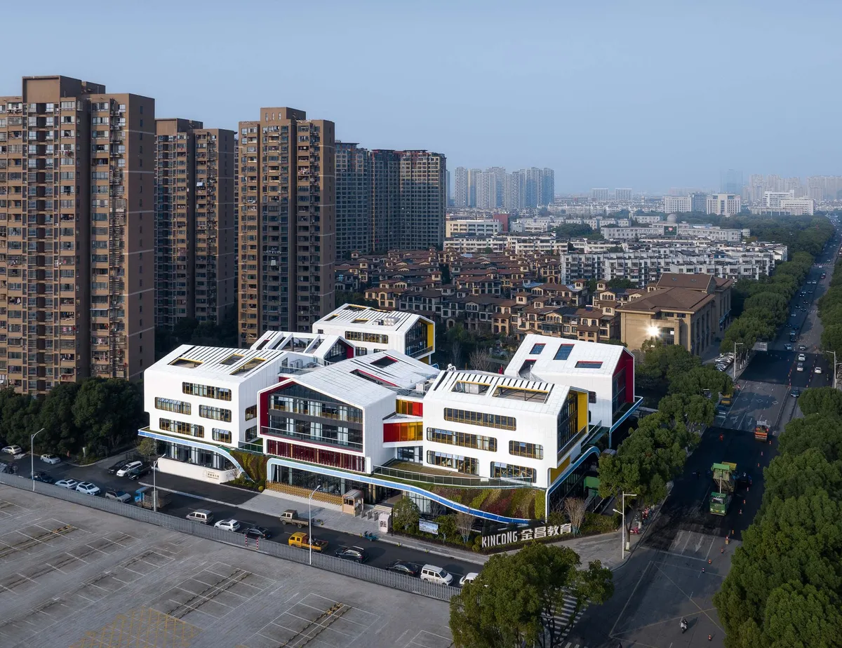 LYCS Architecture Breaks a Shaoxing Pre-School into Six White Cabins Around a Green Carpet