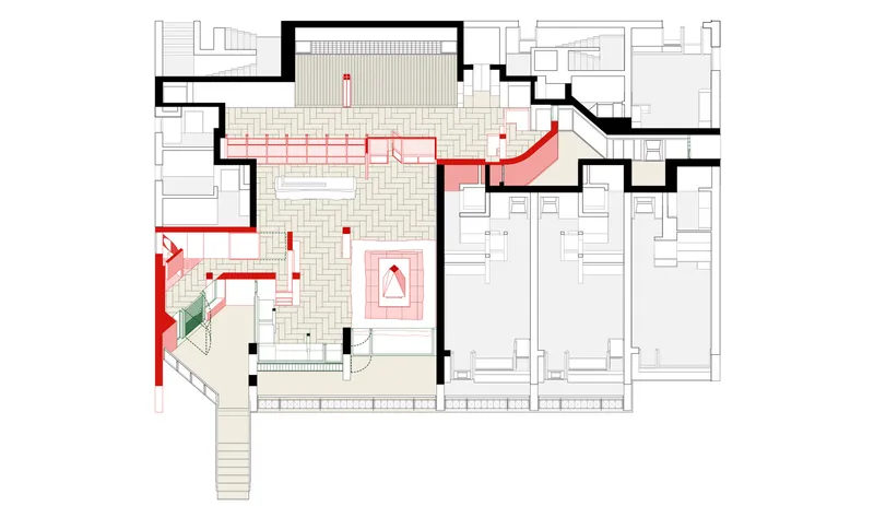 Floor plan drawing showing central courtyard with red circulation routes and adjoining residential units