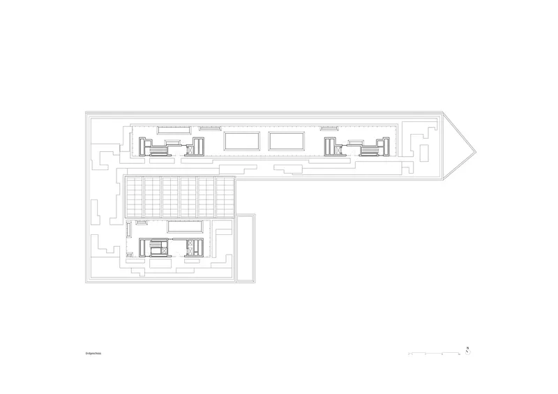 Basement floor plan drawing showing parking layout and service cores in angled building volume