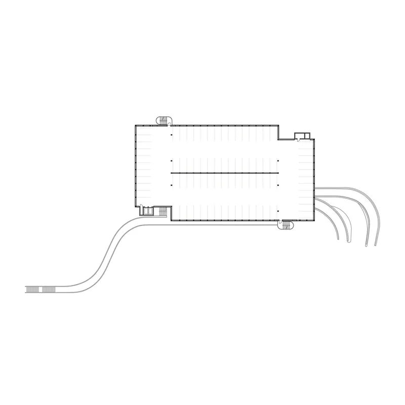 Floor plan drawing showing the rectangular volume with curving access ramps at the corner
