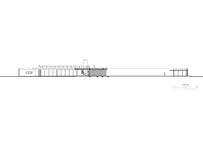 Section drawing revealing the interior spatial organization with double-height volumes and connecting circulation