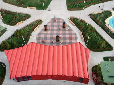 gh3* Wraps a Barrel-Vaulted Strawberry-Red Pavilion Around Edmonton's Newest Park