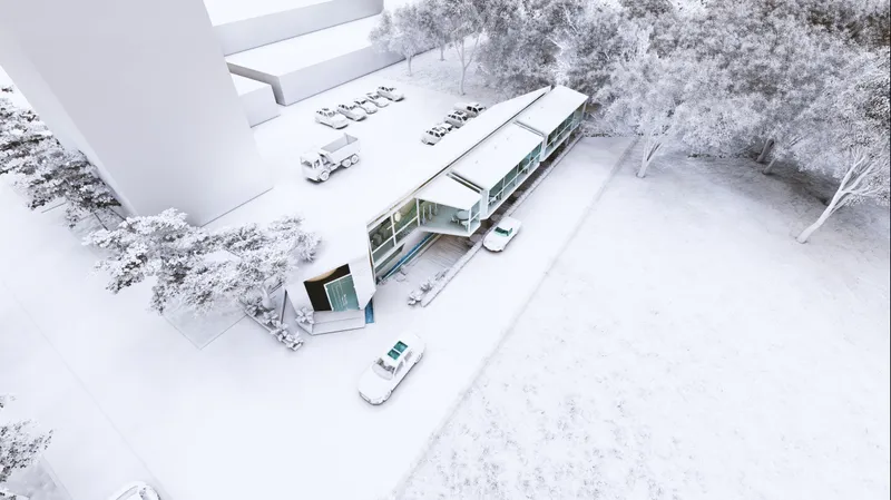 Aerial view showcasing the café's elongated form integrated seamlessly with its urban landscape.