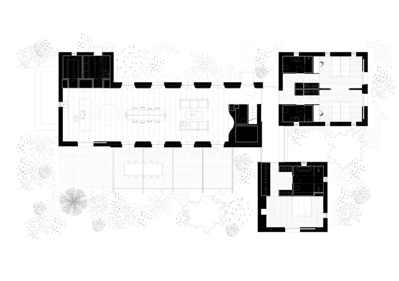 Floor plan drawing showing an elongated main volume with adjacent bedroom and bathroom wings