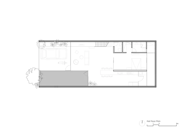 First floor plan drawing showing a linear layout with courtyard, stair, and service rooms
