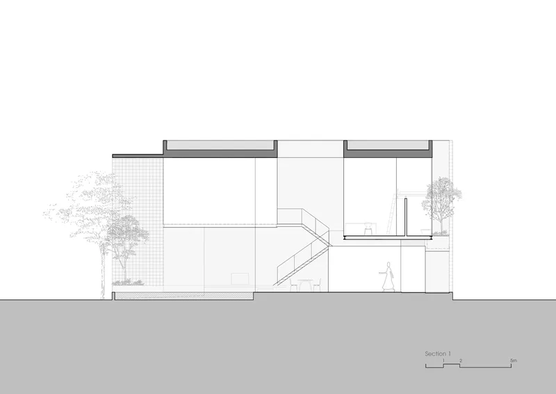 Section drawing showing a two-story interior with central staircase and flanking trees