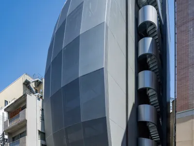 Kensuke Aisaka Wraps a Tokyo Music Building in a Mesh Membrane That Sings to the Street