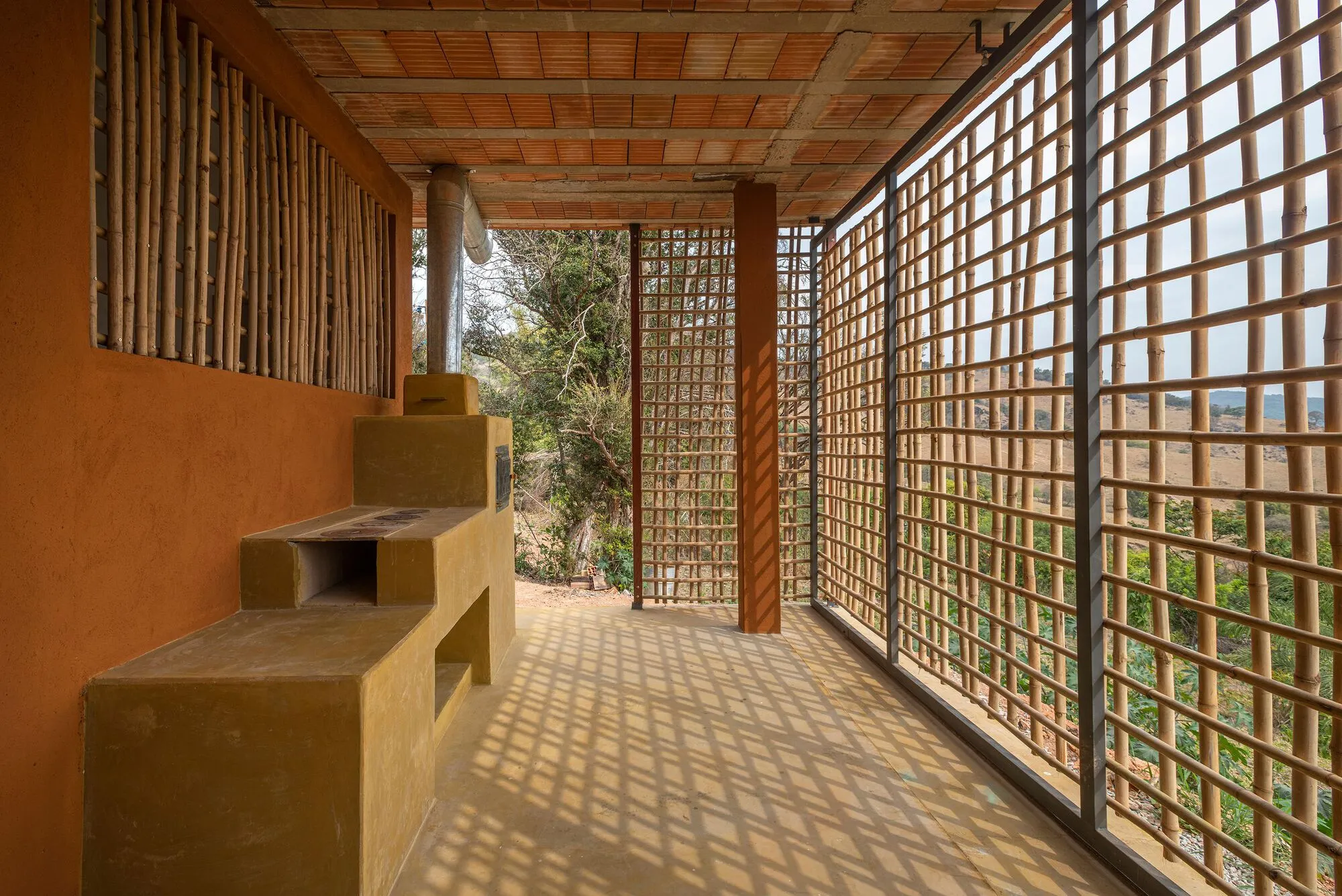Vazio S/A Wraps a Rural Brazilian House in Bamboo Louvers for Under $380 per Square Meter